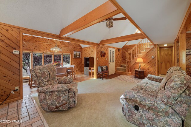 109 Glenbrook Dr, Dingmans Ferry, PA 18328 - living room with wood walls, a chandelier, stairway, and a ceiling fan