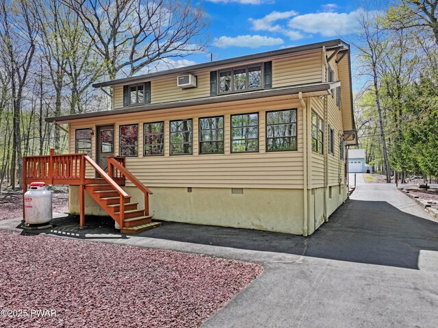 109 Glenbrook Dr, Dingmans Ferry, PA 18328 - view of front of home with a wall unit AC and crawl space