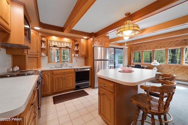 109 Glenbrook Dr, Dingmans Ferry, PA 18328 - kitchen with stainless steel appliances, open shelves, light countertops, a kitchen island, and a breakfast bar area