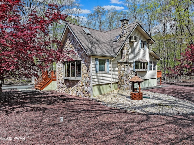 109 Glenbrook Dr, Dingmans Ferry, PA 18328 - view of side of property featuring stone siding, a chimney, and roof with shingles