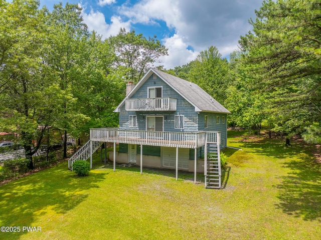 511 Overlook Ter, Stroudsburg, PA 18360 - back of property with stairs, a chimney, a deck, and a yard