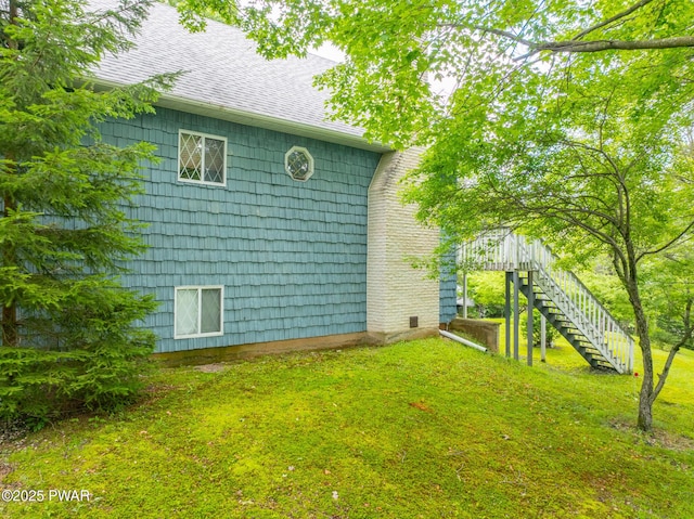 511 Overlook Ter, Stroudsburg, PA 18360 - view of property exterior featuring stairs, a shingled roof, and a yard