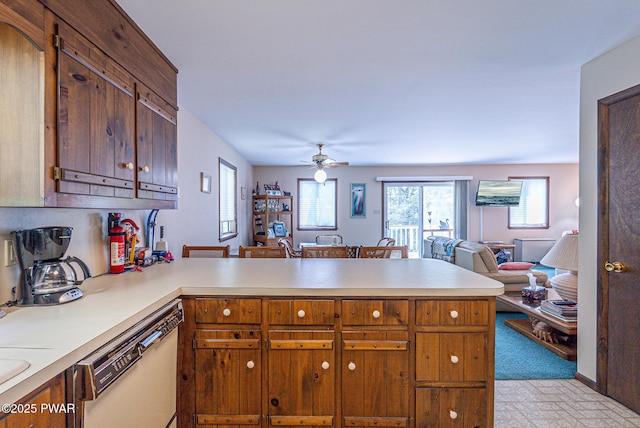 511 Overlook Ter, Stroudsburg, PA 18360 - kitchen with dishwashing machine, a peninsula, open floor plan, light countertops, and a ceiling fan
