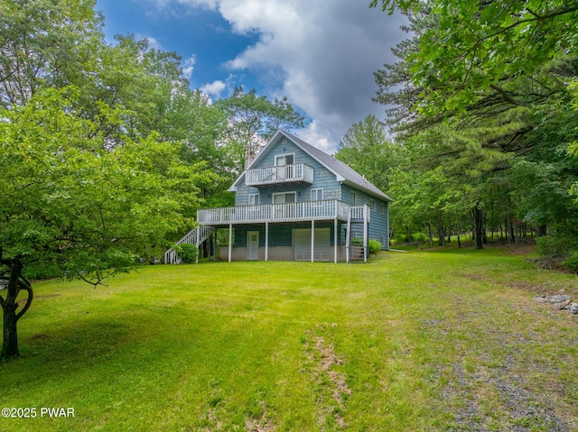 511 Overlook Ter, Stroudsburg, PA 18360 - back of house featuring a yard, stairway, a deck, and a chimney