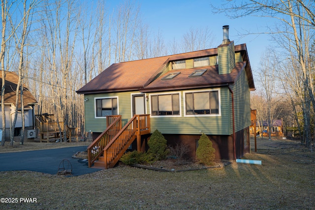 view of front facade with a shingled roof