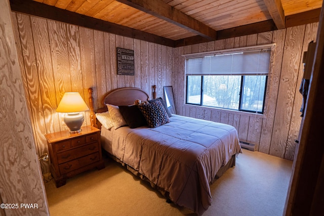 bedroom featuring beam ceiling, light colored carpet, wooden ceiling, and wooden walls