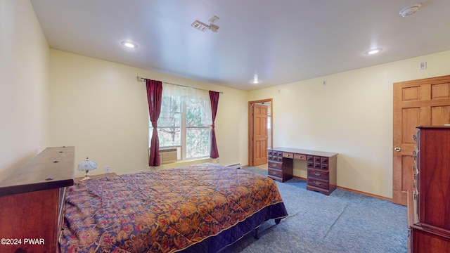 carpeted bedroom featuring cooling unit and baseboard heating