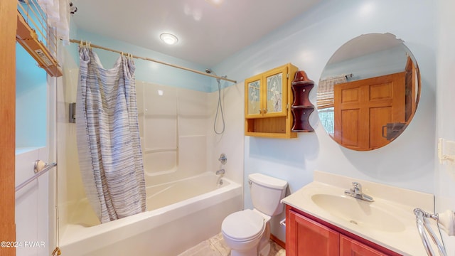 full bathroom featuring tile patterned floors, vanity, shower / bath combination with curtain, and toilet