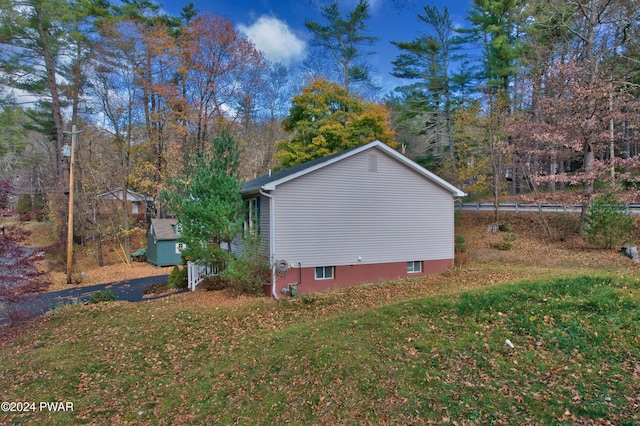 view of property exterior with a yard