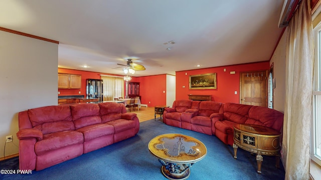 living room featuring ceiling fan and ornamental molding