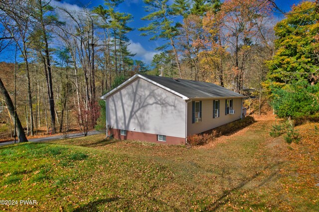 view of property exterior featuring a yard