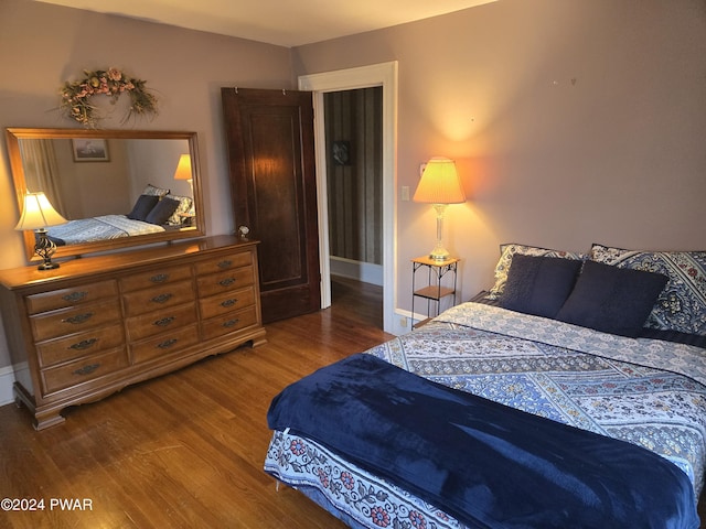 bedroom featuring wood-type flooring