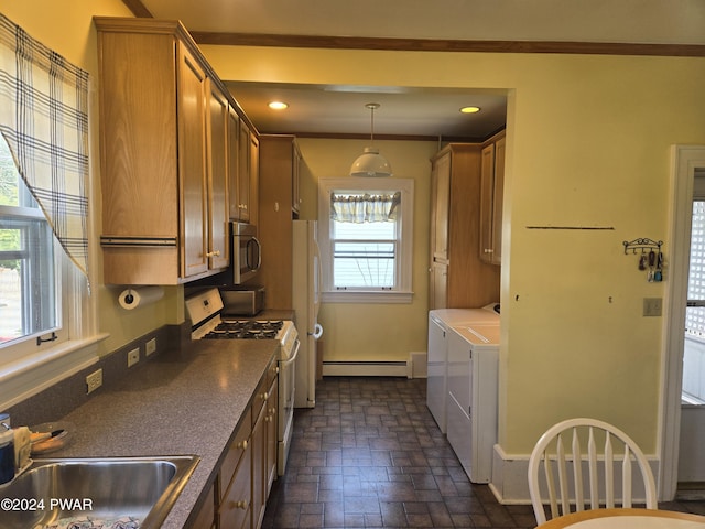 kitchen featuring sink, a baseboard radiator, washing machine and dryer, decorative light fixtures, and white appliances