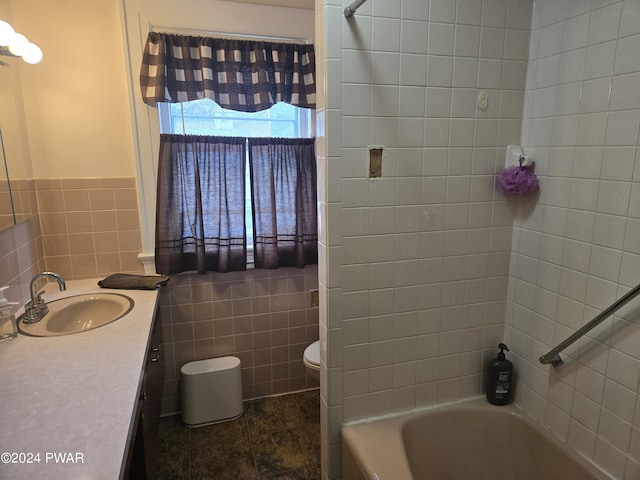 full bathroom featuring shower / bathtub combination, vanity, tile walls, and toilet