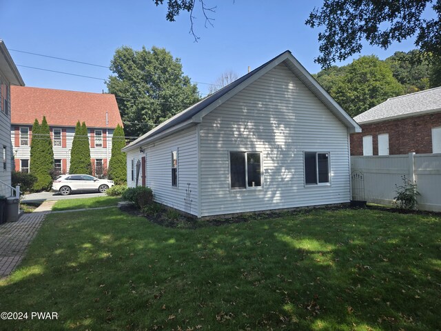 view of property exterior featuring a yard