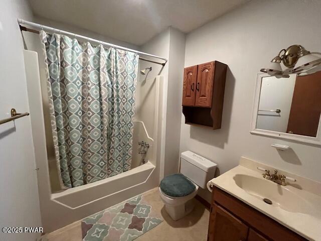 full bathroom with vanity, toilet, and shower / tub combo with curtain