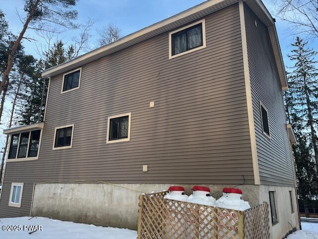 view of snow covered property