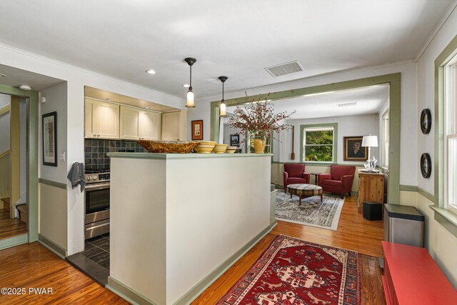 182 Lcpl Jacob Beisel Rd, Lackawaxen, PA 18435 - bar area featuring wood finished floors, decorative backsplash, crown molding, decorative light fixtures, and stairway