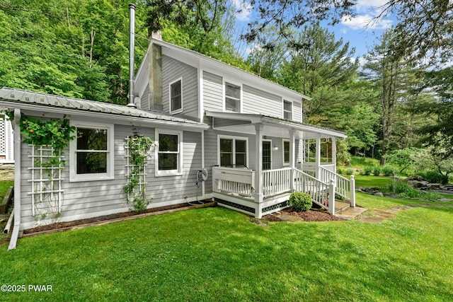 182 Lcpl Jacob Beisel Rd, Lackawaxen, PA 18435 - rear view of property featuring covered porch, a lawn, and metal roof