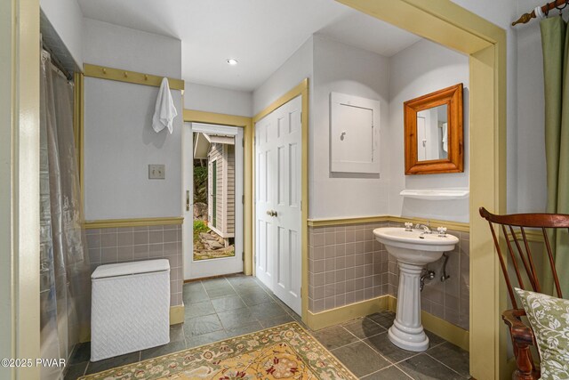 182 Lcpl Jacob Beisel Rd, Lackawaxen, PA 18435 - full bathroom with tile walls, a wainscoted wall, recessed lighting, tile patterned floors, and a sink