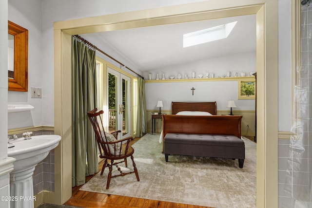 182 Lcpl Jacob Beisel Rd, Lackawaxen, PA 18435 - bedroom featuring a skylight, vaulted ceiling, access to exterior, wood finished floors, and ensuite bathroom