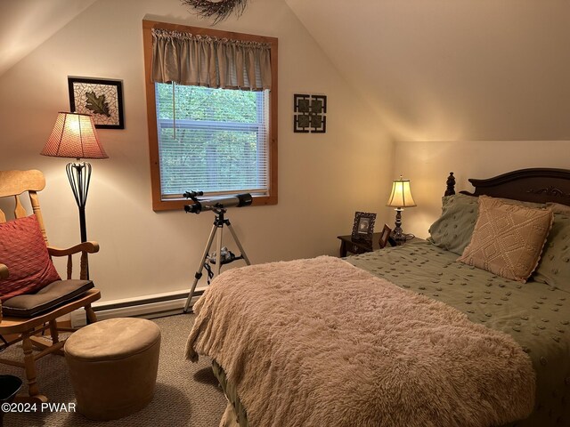 bedroom featuring baseboard heating and lofted ceiling