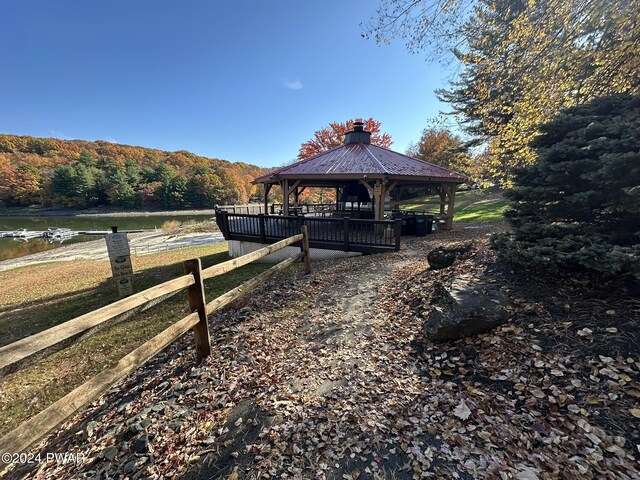 exterior space with a gazebo and a water view