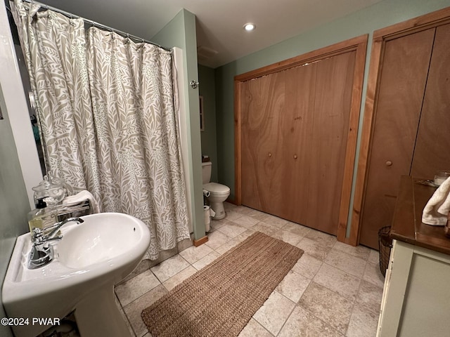 bathroom with toilet and sink