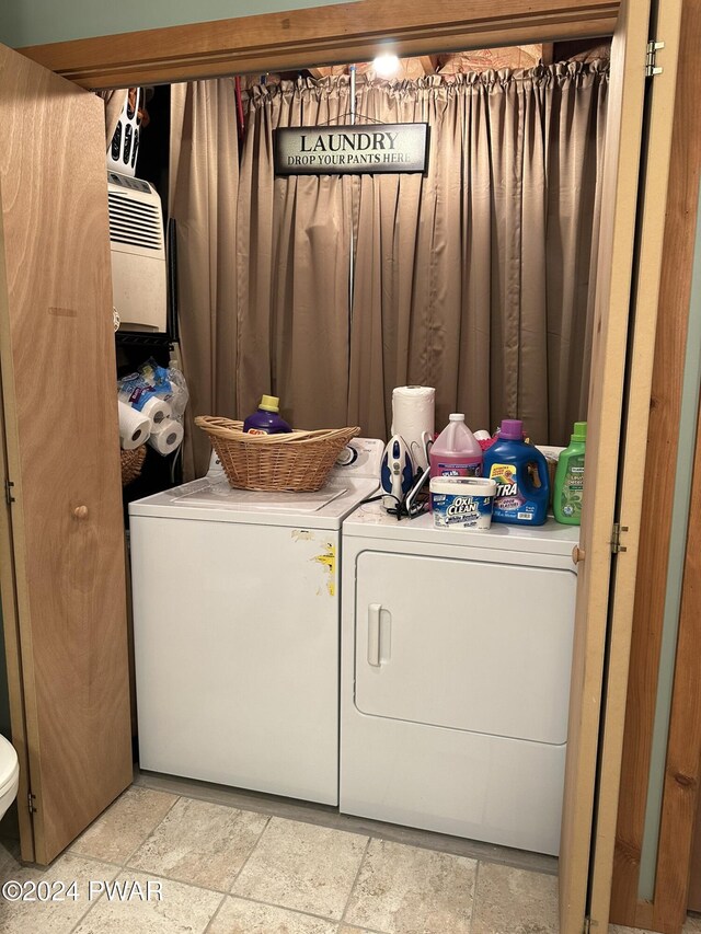 washroom featuring washing machine and dryer