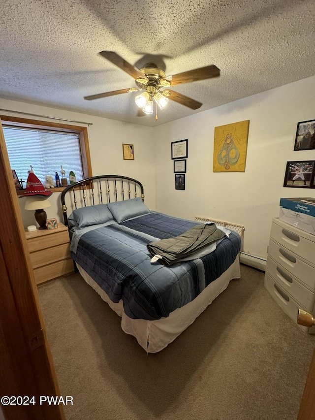 bedroom with a textured ceiling, carpet floors, ceiling fan, and a baseboard heating unit