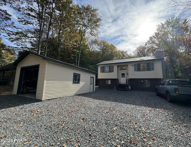 split foyer home with an outbuilding and a garage