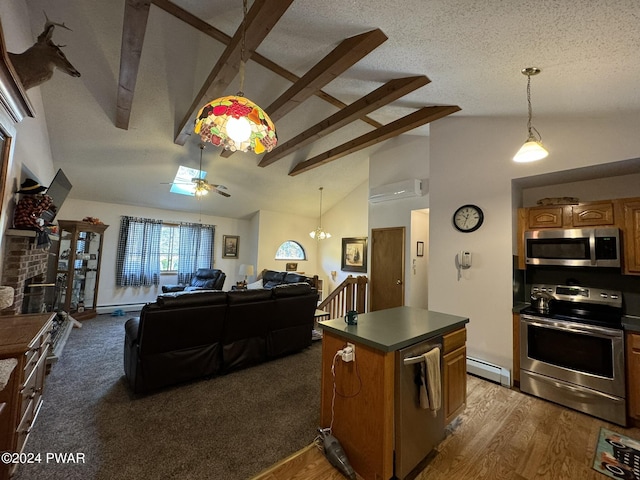 kitchen with stainless steel appliances, a baseboard radiator, beamed ceiling, a textured ceiling, and a kitchen island