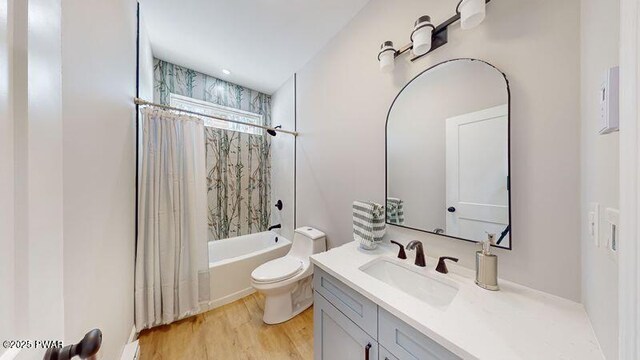 empty room featuring light hardwood / wood-style flooring, an AC wall unit, ceiling fan, and baseboard heating