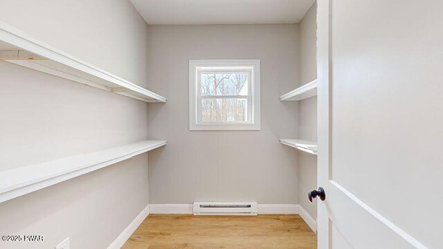 bathroom with hardwood / wood-style floors and separate shower and tub