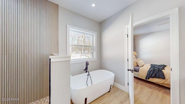 kitchen featuring white cabinets, decorative light fixtures, sink, and dishwasher