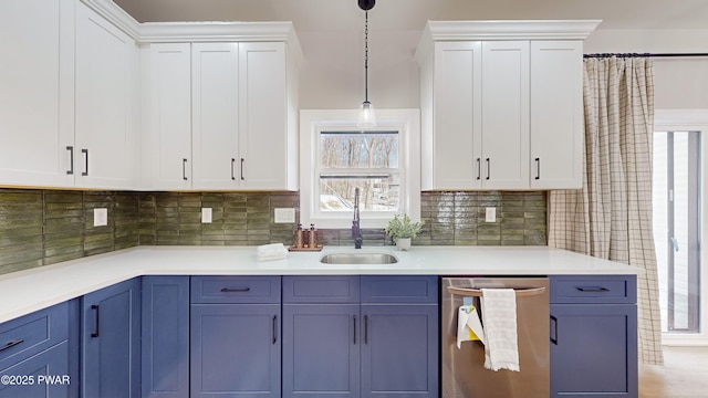 kitchen featuring sink, blue cabinetry, dishwasher, white cabinetry, and hanging light fixtures