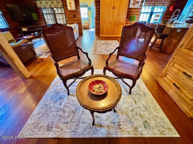 living area featuring plenty of natural light and wood finished floors
