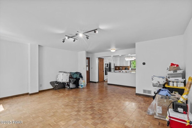 29 Hirshorn Dr, Newfoundland, PA 18445 - living room with a chandelier, baseboards, and track lighting