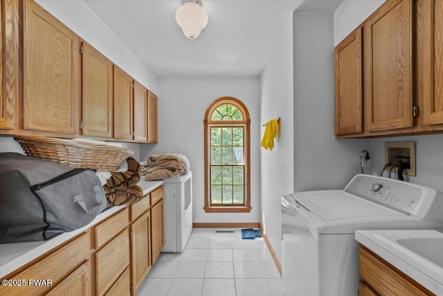 29 Hirshorn Dr, Newfoundland, PA 18445 - laundry area with washer and dryer, cabinet space, baseboards, and light tile patterned flooring
