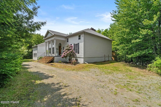 29 Hirshorn Dr, Newfoundland, PA 18445 - view of side of home featuring a porch and a chimney