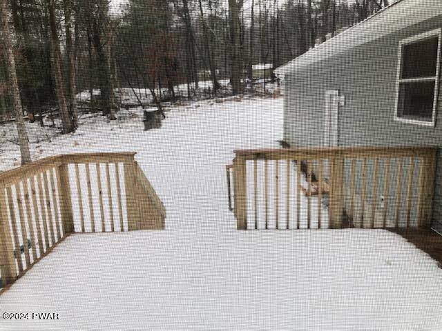 view of snow covered deck