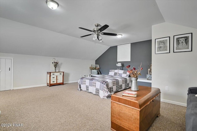 bedroom with ceiling fan, carpet floors, and lofted ceiling