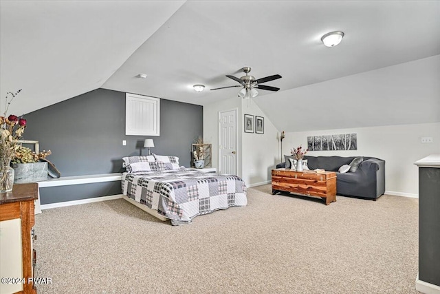 carpeted bedroom with ceiling fan and vaulted ceiling