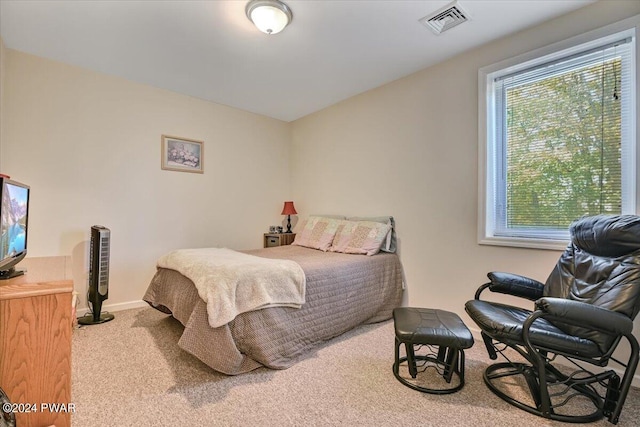 bedroom with light carpet