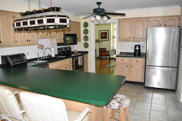 kitchen with ceiling fan, appliances with stainless steel finishes, decorative backsplash, light tile patterned flooring, and ornamental molding