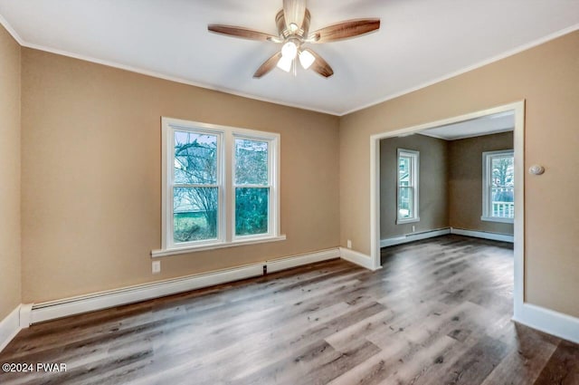 spare room with ceiling fan, hardwood / wood-style floors, a baseboard radiator, and ornamental molding