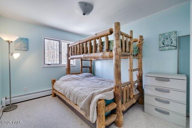 bedroom featuring a baseboard heating unit