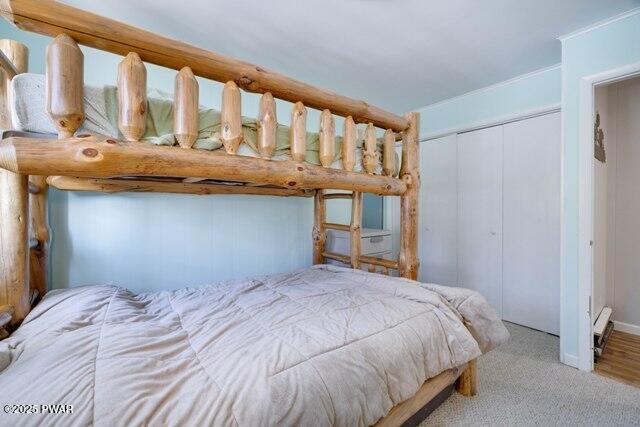 carpeted bedroom with a closet