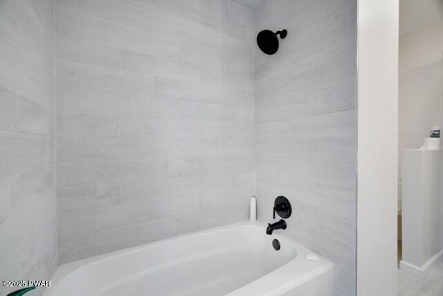 bathroom with shower / bathing tub combination