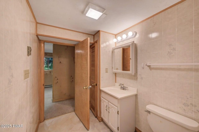 77 Brookfield Rd, Lake Ariel, PA 18436 - bathroom featuring tile walls, vanity, a baseboard heating unit, and crown molding